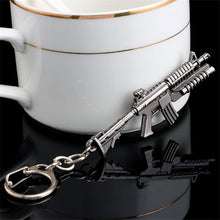 Load image into Gallery viewer, 2017 New game M16 Novelty Items AK47 Guns Keychain pendant Trinket M4A1 Sniper Key Chain 10 styles Jewelry Souvenirs Gift Men